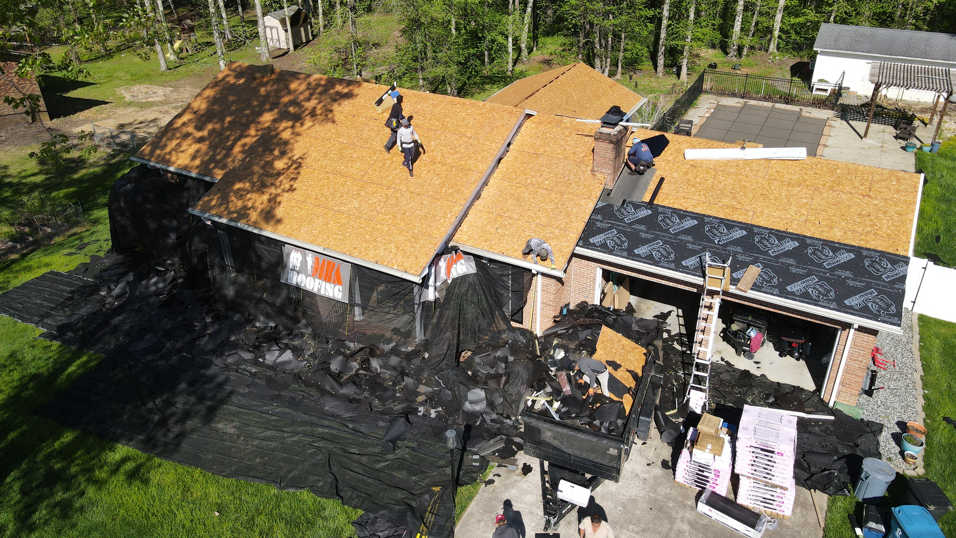 Local roofing crew replacing a roof on a North Carolina home